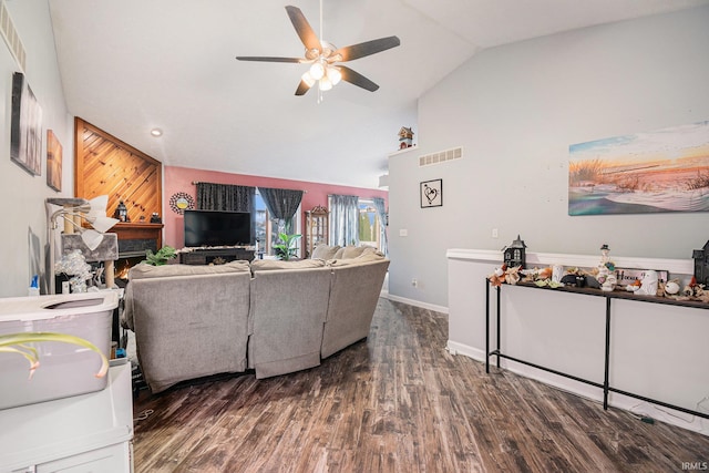 living room with dark hardwood / wood-style floors, ceiling fan, and vaulted ceiling