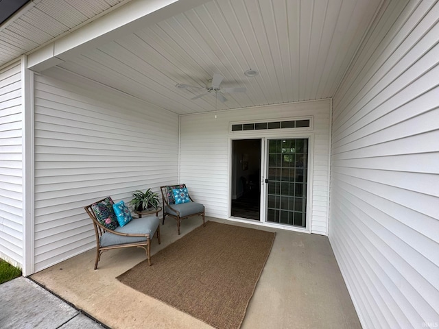 doorway to property featuring a patio area and ceiling fan