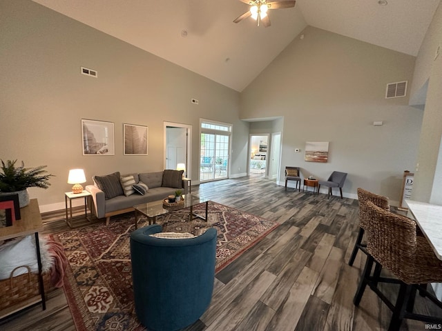 living room featuring high vaulted ceiling, dark wood-type flooring, and ceiling fan