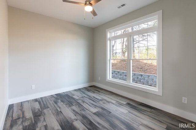 unfurnished room with hardwood / wood-style flooring and ceiling fan