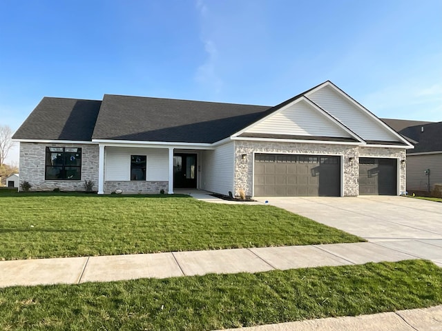 view of front of property with a garage and a front yard