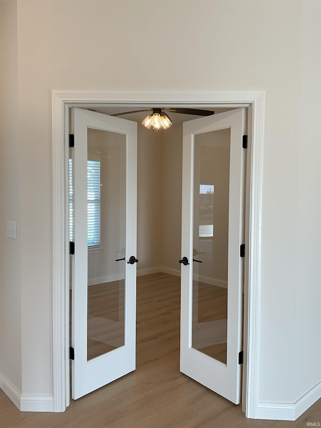 interior space featuring french doors and light hardwood / wood-style floors