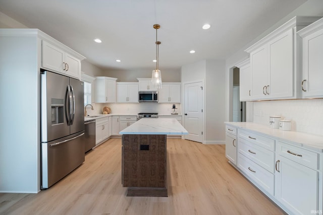 4848 Abbeyville Dr, Lafayette, IN 47909 - kitchen with stainless steel appliances, light wood-style floors, white cabinets, recessed lighting, and a kitchen island