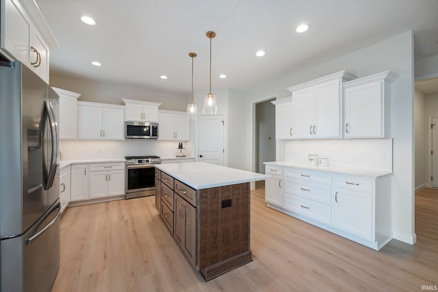 4848 Abbeyville Dr, Lafayette, IN 47909 - kitchen with appliances with stainless steel finishes, white cabinetry, light wood-type flooring, decorative backsplash, and recessed lighting