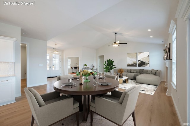 4848 Abbeyville Dr, Lafayette, IN 47909 - dining area with light wood-style floors, ceiling fan, baseboards, and lofted ceiling