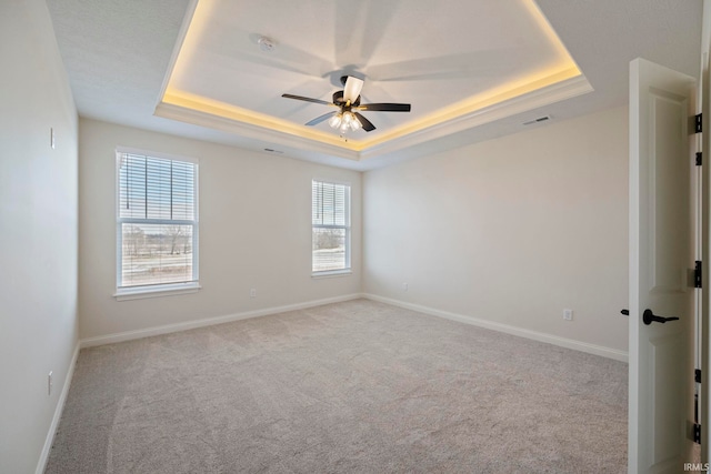 4848 Abbeyville Dr, Lafayette, IN 47909 - unfurnished room with a raised ceiling, carpet flooring, healthy amount of natural light, and a ceiling fan