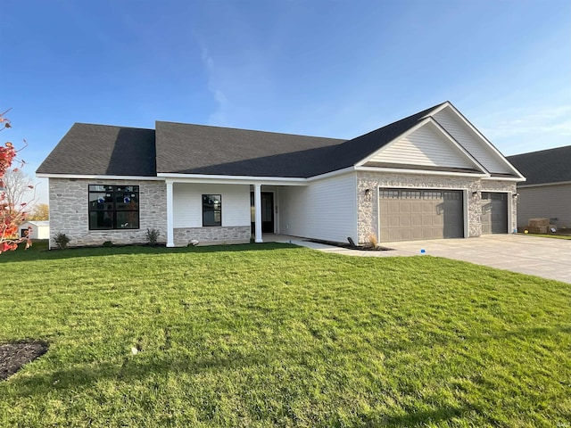 view of front of home with a garage and a front yard