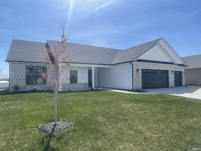 4848 Abbeyville Dr, Lafayette, IN 47909 - ranch-style home with an attached garage, stone siding, driveway, and a front lawn