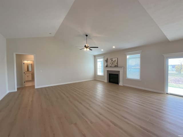 unfurnished living room featuring light wood-type flooring and plenty of natural light