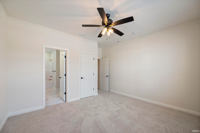 4848 Abbeyville Dr, Lafayette, IN 47909 - unfurnished bedroom featuring light carpet, baseboards, ensuite bathroom, and a ceiling fan