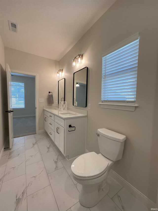 bathroom with vanity and toilet