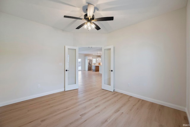 4848 Abbeyville Dr, Lafayette, IN 47909 - spare room featuring french doors, light wood-style flooring, and baseboards