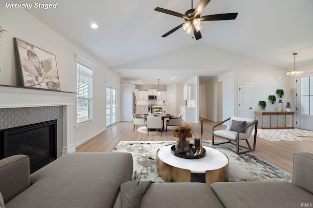 4848 Abbeyville Dr, Lafayette, IN 47909 - living area with light wood-type flooring, plenty of natural light, lofted ceiling, and ceiling fan