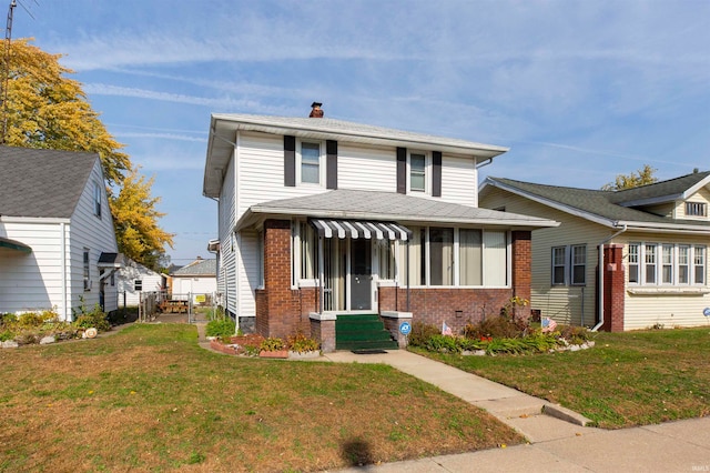 view of front of home with a front yard