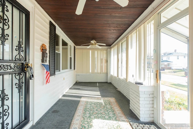 unfurnished sunroom featuring wooden ceiling