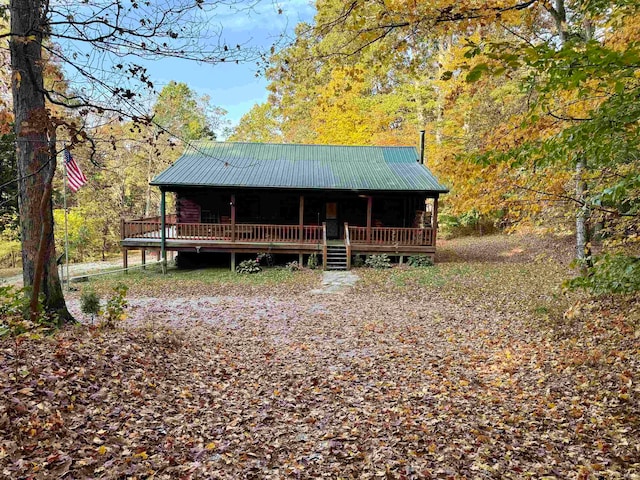 log home with a wooden deck