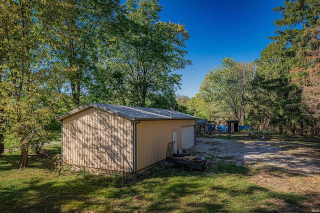 view of outbuilding featuring a lawn