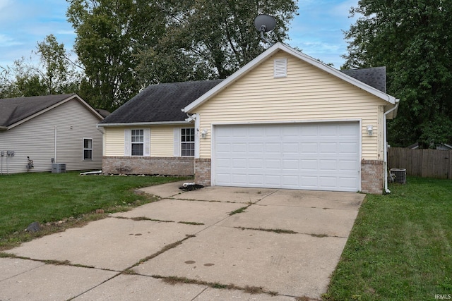 view of front facade featuring a front yard and a garage