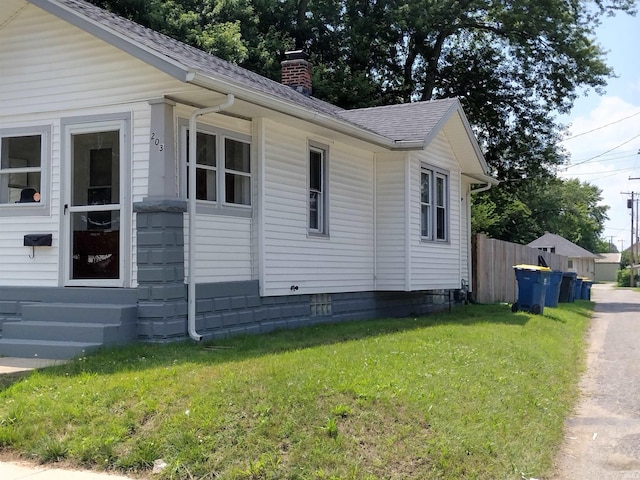 view of property exterior featuring a yard