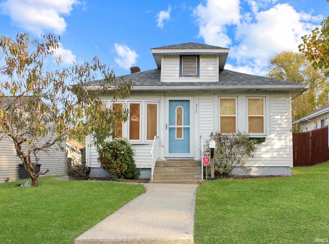 bungalow-style home featuring a front yard