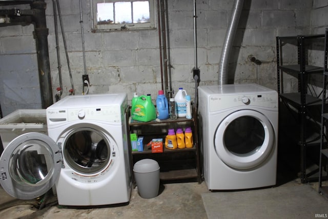 laundry area featuring washing machine and clothes dryer