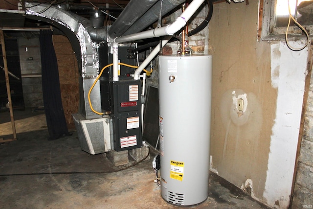 utility room featuring heating unit and water heater