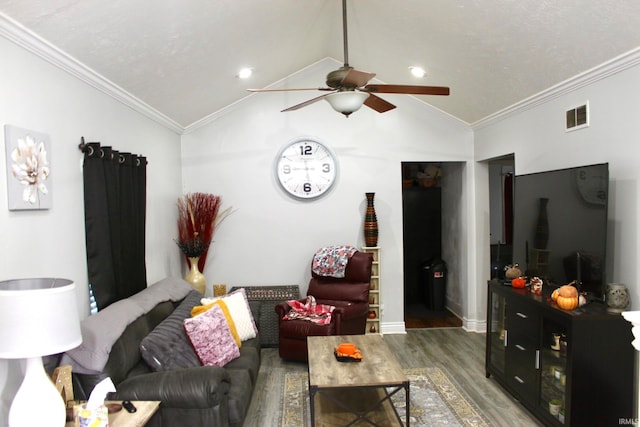 living room featuring ornamental molding, dark wood-type flooring, lofted ceiling, and ceiling fan