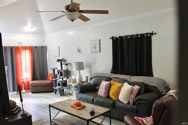 living room with light hardwood / wood-style floors, ornamental molding, ceiling fan, and vaulted ceiling