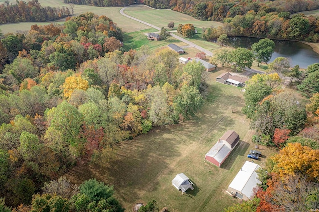 birds eye view of property with a rural view and a water view