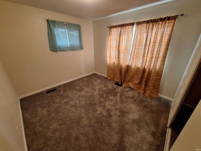 spare room featuring carpet