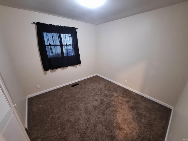 empty room featuring carpet flooring