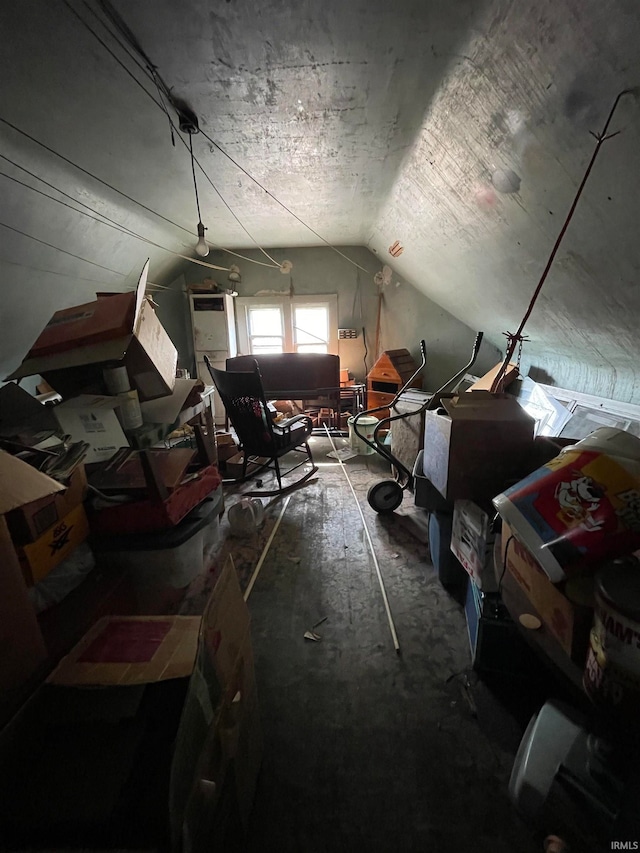 additional living space featuring lofted ceiling