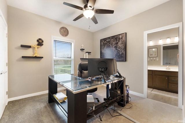 carpeted office with ceiling fan