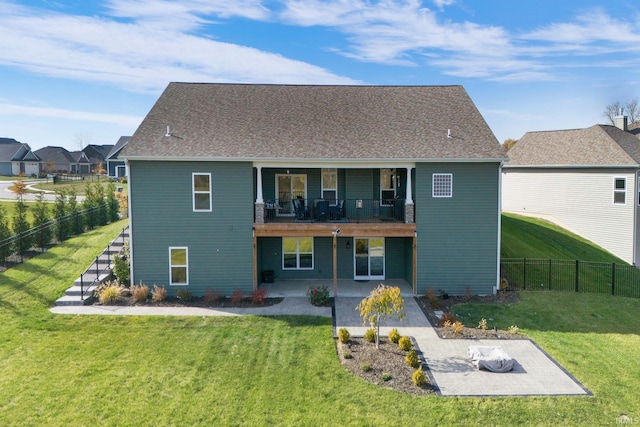 back of property featuring a patio area, a lawn, and a balcony