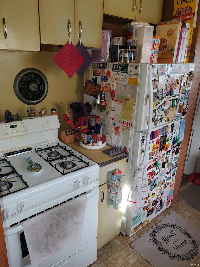 kitchen with white range with gas stovetop