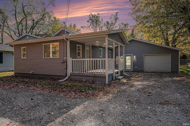 view of front of house featuring covered porch and a garage