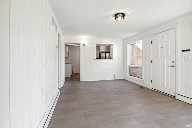 entrance foyer featuring baseboard heating