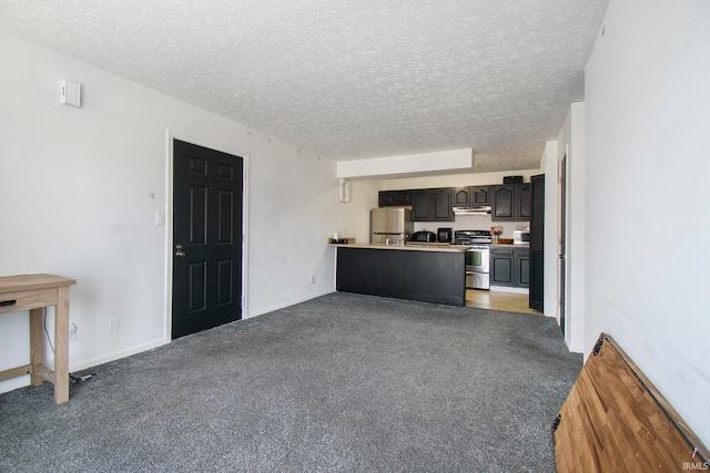 unfurnished living room with a textured ceiling and dark carpet