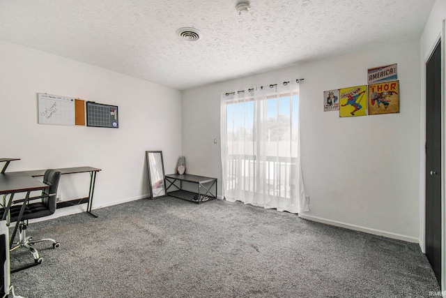 office with carpet flooring and a textured ceiling