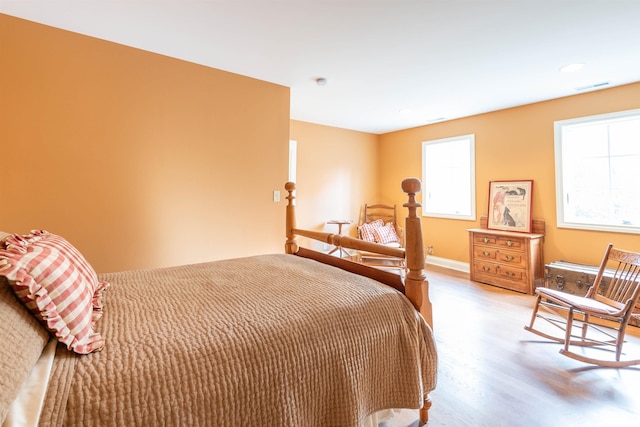 bedroom with light hardwood / wood-style floors