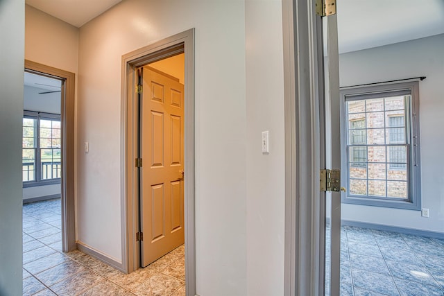 hallway featuring plenty of natural light