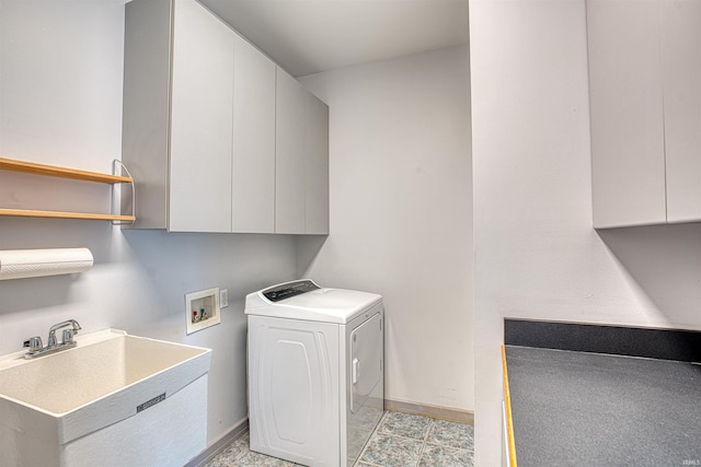 laundry area featuring washer / clothes dryer, sink, and cabinets