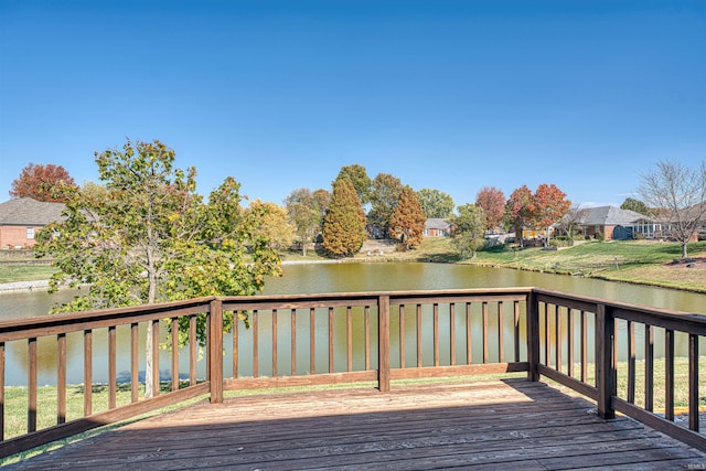 wooden deck featuring a water view