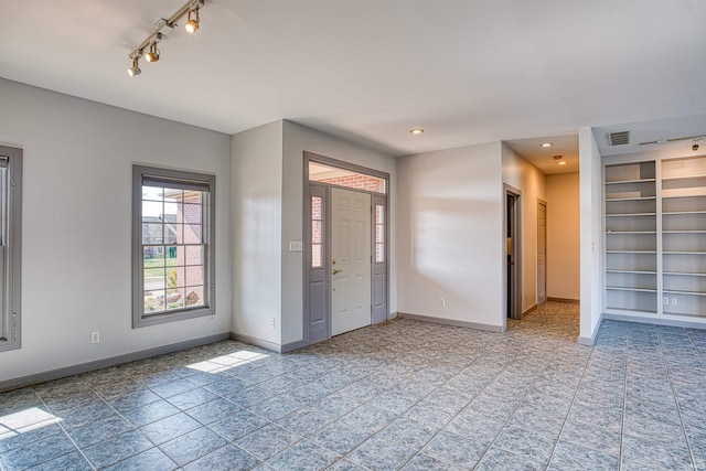 entrance foyer featuring light tile patterned floors