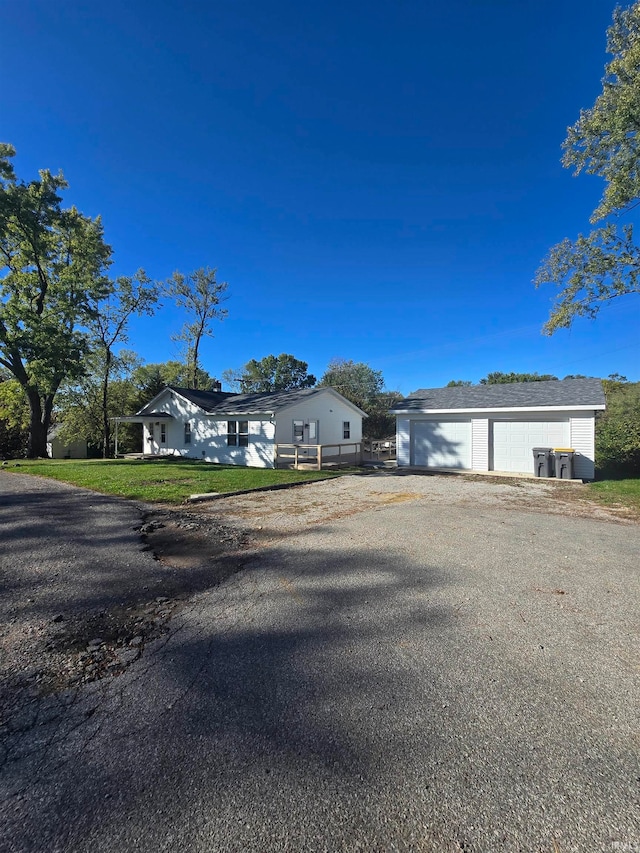 single story home with a garage