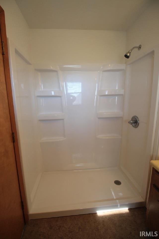 bathroom featuring vanity and a shower