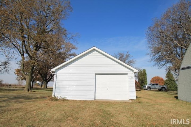 garage featuring a yard