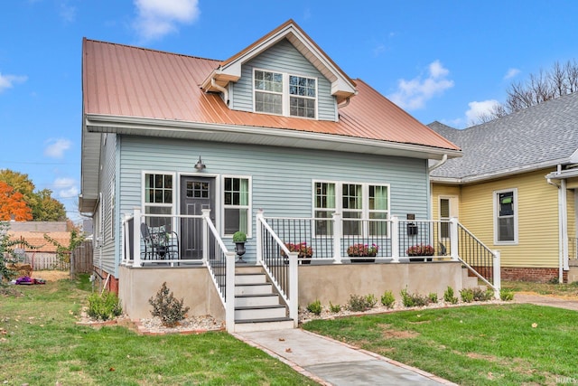 bungalow-style home featuring a front yard