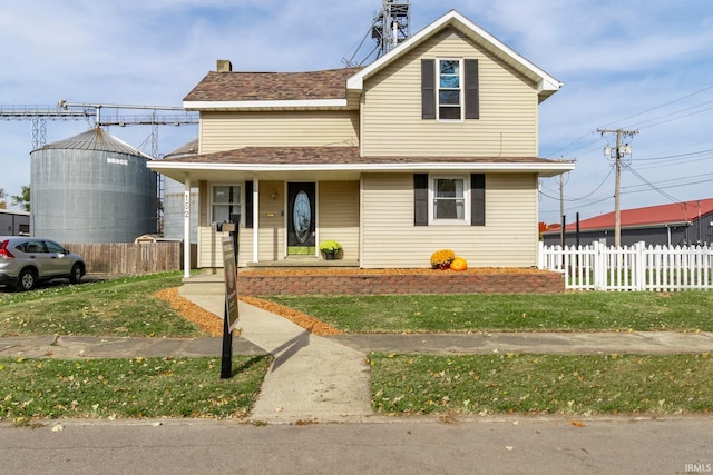 view of front of home with a front yard and a porch