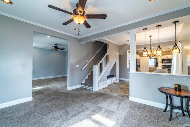 interior space with carpet flooring, black appliances, white cabinetry, pendant lighting, and crown molding